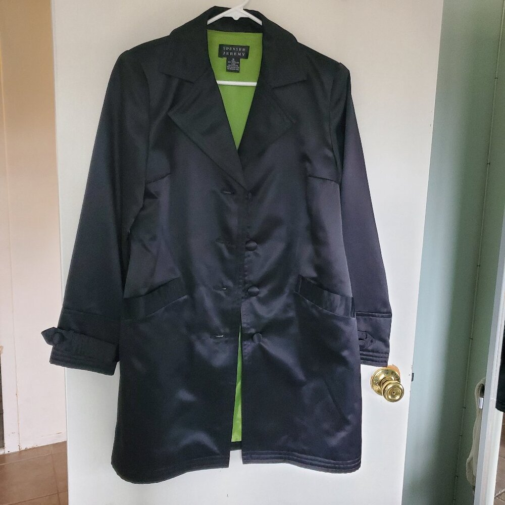 Thrench coat the look of Satin.  100% polyester 100% acetate trench